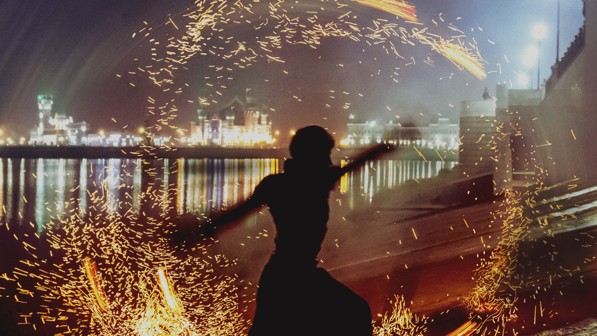Woman with sparks in the background