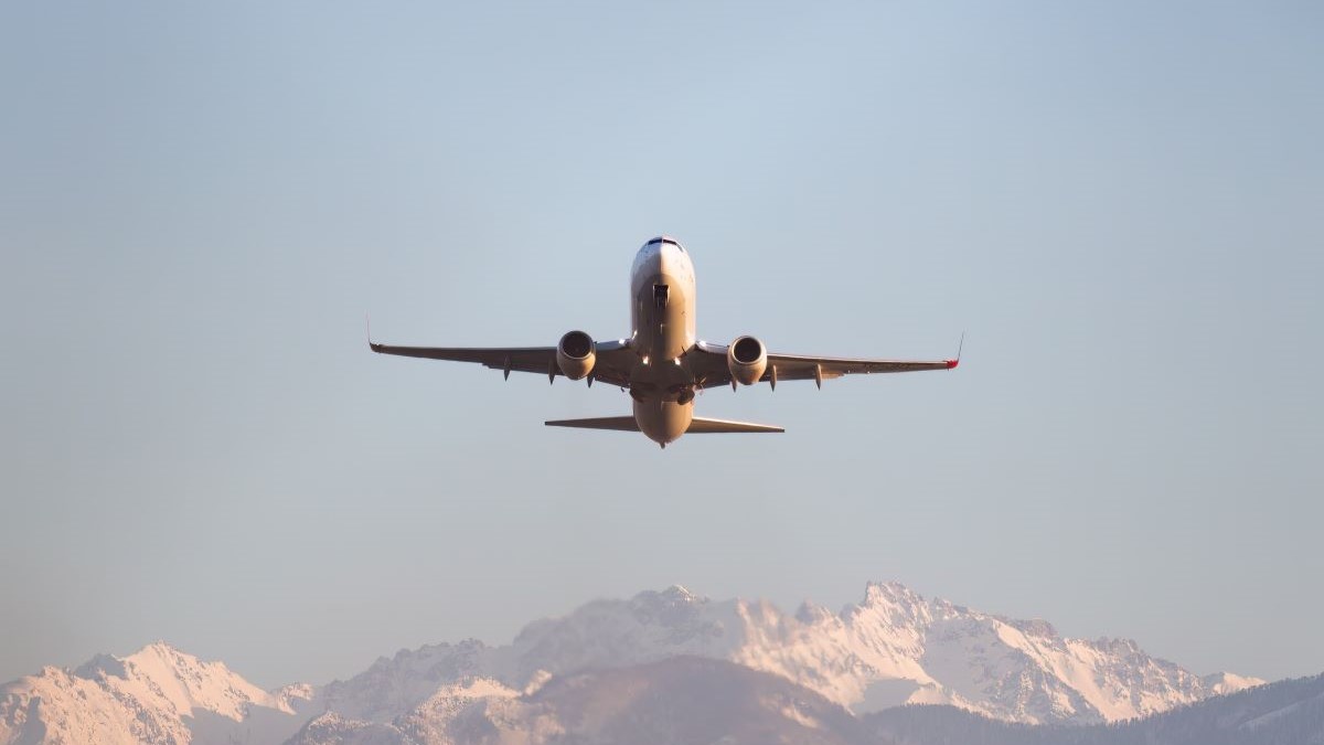 Aeroplane flying above mountains